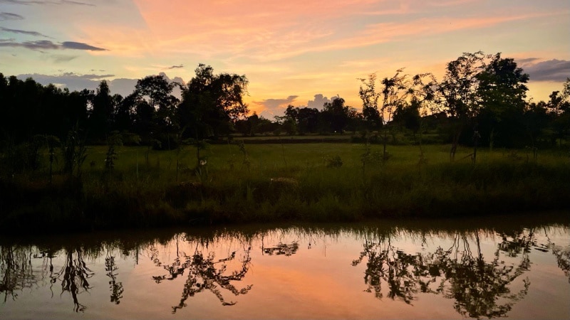 Khok Nong Na Model beautiful sunset over the lake using agroforestry prinicples in Isaan, Thailand