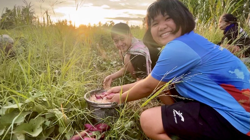 Children learning Permaculture design course in thailand on organic farm in isaan